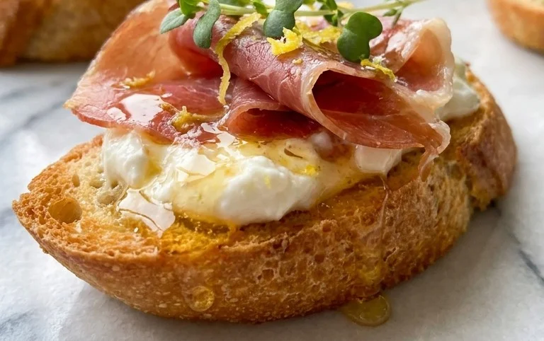 Beef Prosciutto Crostini with Burrata and Lemon Honey Drizzle